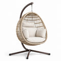 Sedia sospesa in rattan con cuscini in poliestere e struttura in acciaio marrone